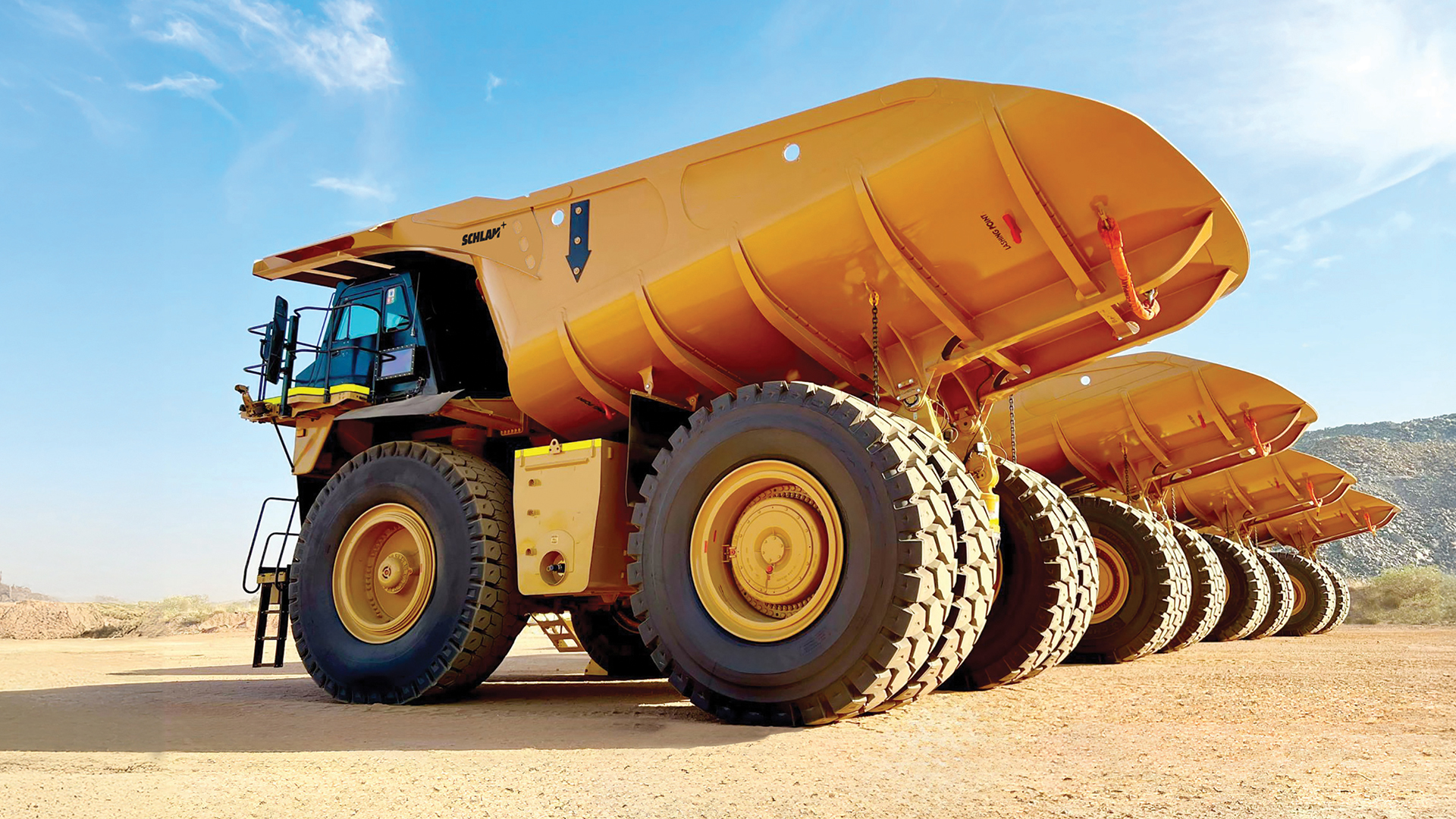 Fleet of mining haul trucks fitted with Hercules truck beds customised and designed to optimise payload, improve productivity and reduce operating costs in surface mining operations.